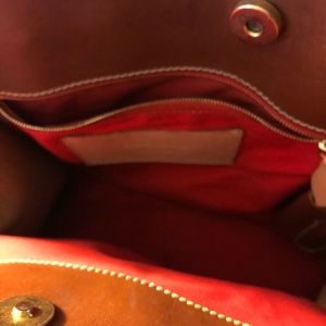 Dooney and Burke tell and tan leather satchel